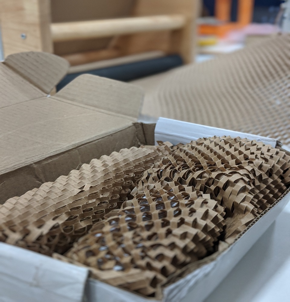 Honeycomb kraft paper void fill in a cardboard box
